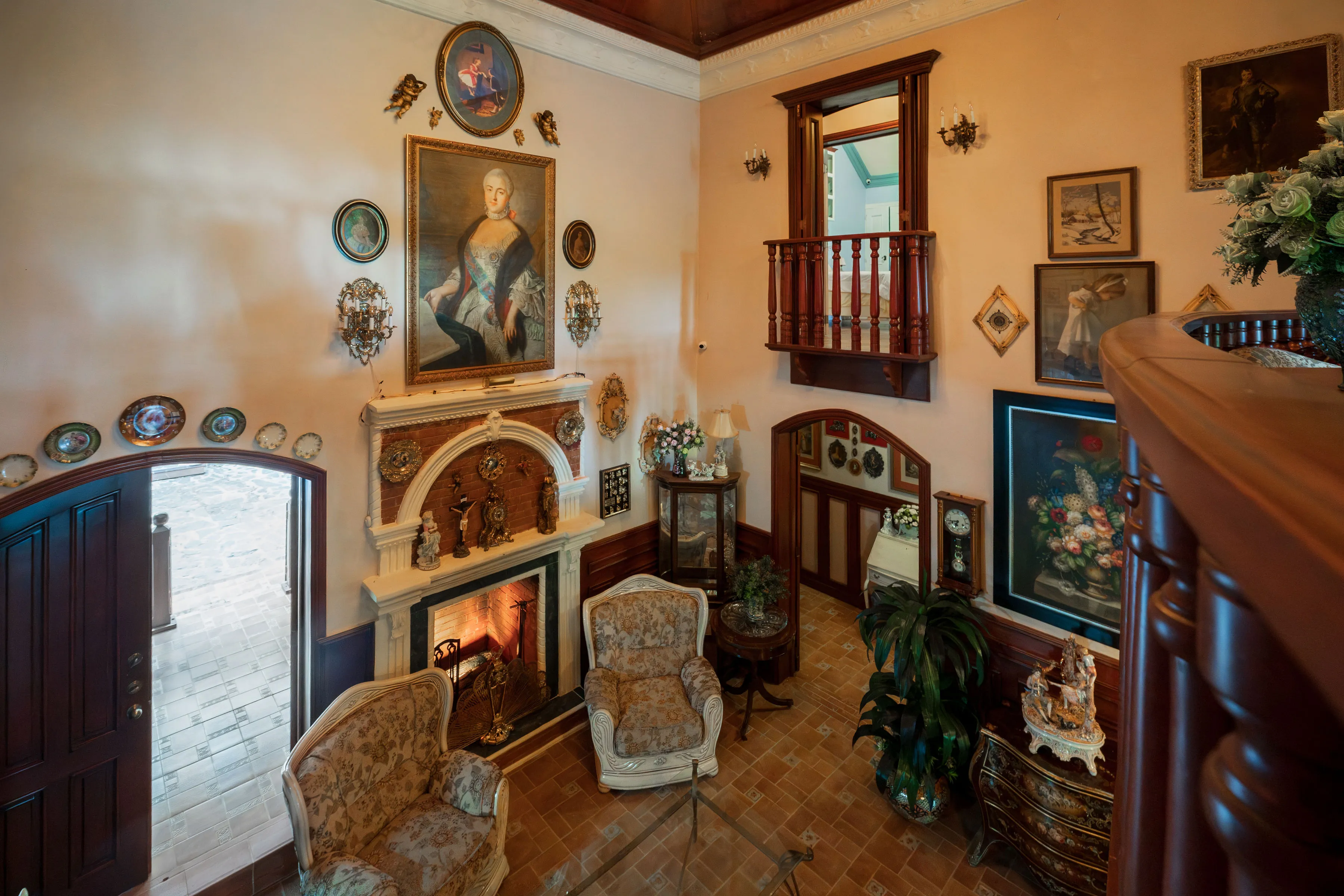 Fireplace lounge beneath the upstairs balcony